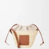 Bolsa tipo balde com cordão em folha de palmeira e pele de bezerro Bolsa tipo balde com cordão em folha de palmeira e pele de bezerro