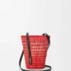 Bolsa trançada em palha de iraca e pele de bezerro Bolsa trançada em palha de iraca e pele de bezerro