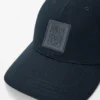Boné com emblema em lona Boné com emblema em lona