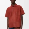 Camisas de manga curta em pele de cabra camurçada Camisas de manga curta em pele de cabra camurçada
